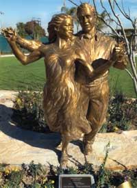 SHALL WE DANCE?: Colorado-based artist Gary Alsum created “Promenade,” a bronze statue on the grounds of the affordable Little Lake Village at Santa Fe Springs.