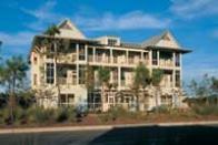 At WaterColor in Northwest Florida, multifamily buildings connect to the larger community through landscaping, much of which relies on native plants.