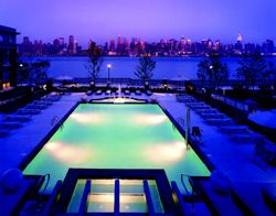 POOLSIDE PANORAMA: Riverside West residents swim and sunbathe against a backdrop of skyscrapers.