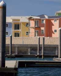 DREAM IN COLOR: These condos at Bimini Bay Resort and Casino feature siding from Alcoa's DreamColor line, a new set of exterior products available in a baseline palette of 700 colors. The island hues were custom created to match local flowers. The DreamColor line includes siding, soffit, fascia, and accents to shutters and window treatments.