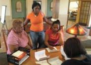New Orleans evacuees fill out paperwork for a new apartment in Dallas.