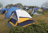 This tent city in the St. Thomas neighborhood, just southwest of the central business district along the river, houses contractors working to rehabilitate a store and other surrounding commercial and private property.