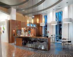 Gen Yers jumpstart their day at The Ashton's hip, colorful coffee bar. The space doubles as a community kitchen with top-of-the-line appliances sure to impress the 20-something-crowd. The kitchen also features luncheon seating, a veranda, and cocktail high-top tables for evening gatherings. The Dallas property was developed by The Hanover Co.
