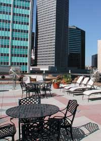 The façade and rooftop deck furnishings of Dallas' Post Wilson Building hint of Paris.