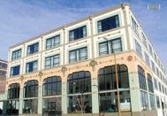 A once boarded-up white box in St. Louis is now home to Packard Lofts, a colorful condo community with 33 loft-style units ranging from $150,000 to $400,000.
