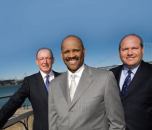 MacFarlane Partners' managing principals are (left to right) Chuck Berman, Victor MacFarlane, and Greg Vilkin.
