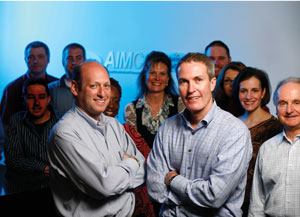 Executive vice presidents (l-r) Jeff Adler, chief property operations officer, and Tim Beaudin, chief development officer, have worked closely with their team members (pictured here) to develop a strategy that will help the Denver-based firm through tough times.