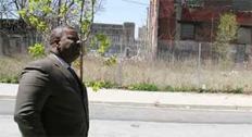 Carl Greene, executive director of the Philadelphia Housing Authority, surveys a parcel of land that sparked a dispute between PHA and HUD.