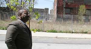 Carl Greene, executive director of the Philadelphia Housing Authority, surveys a parcel of land that sparked a dispute between PHA and HUD.