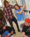 University of Florida students use the laundry room as a social meeting place.