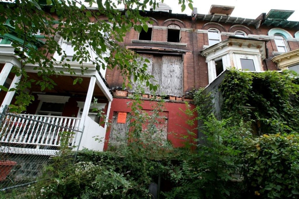 Going Once: This home in North Philadelphia, which has sat vacant for years as the result of a lack of federal funding, is typical of the properties set to be sold by the Philadelphia Housing Authority.