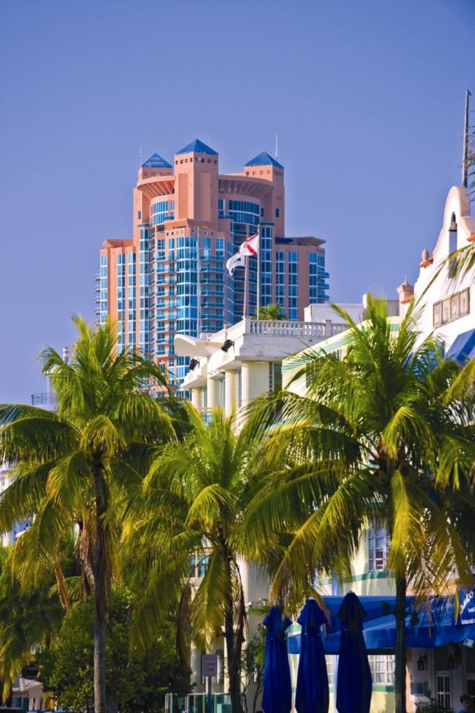 miami south beach cityscape with high rises against blue sky