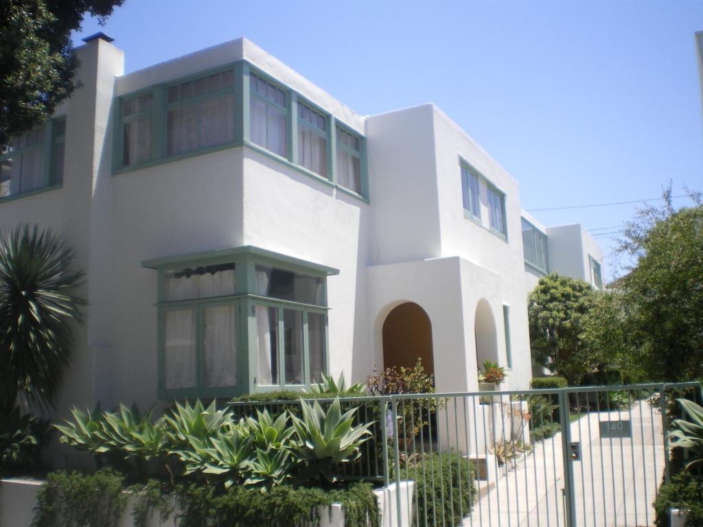 Horatio West Court • Location: Santa Monica, Calif. • Architect: Irving Gill • No. of units: Four • Notable: Gill focused on small-scale, low-cost housing, of which Horatio West Court is an acclaimed example. An early nod to multifamily living, the project, built in 1919, is designed as attached houses with shared pedestrian and vehicle access. It features inexpensive tilt-wall construction, which allowed the architect to blend the California Mission style of his day, using elements such as arched entryways and small patios, with a more modern design. In 1977, the building became the first in Santa Monica to be listed in the National Register of Historic Places.