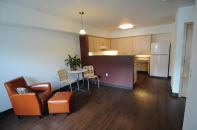Units at The Knoll at Tigard Apartments include such sustainable features as Energy Star appliances and lighting, low-VOC paint, and low-maintenance materials including vinyl plank tile flooring. Ground-floor units have roll-in showers to 

comply with ADA standards.