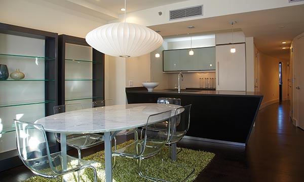 IN VOGUE: Once a former ­tenement building (below), 60 Orchard Street is now a ­boutique condo. Its seven units, all two-bedroom, two-bath, feature unobstructed paths from the living–dining room to a ­dramatic streetside window wall.