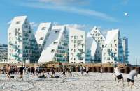 The Julien De Smedt Architects design team hopes to build a warm, vibrant community around the newly constructed Iceberg apartments in Aarhaus, Demark.