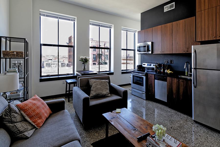 The units at Parkway 301 feature sustainably sourced walnut cabinets, paper-resin countertops, and Energy Star appliances and fixtures.