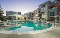 The Calida Group's Elysian at the District property featuring pool deck