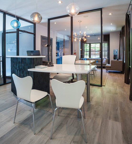 Business centers and leasing offices, such as this one at Cortland Partners' Pointe at Lenox Park in Atlanta, have evolved to reflect modern work environments, incorporating technology and creative design elements.