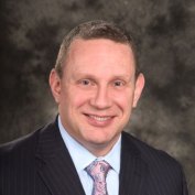 Gregory J. Lozinak, CEO of Monument Real Estate Services.