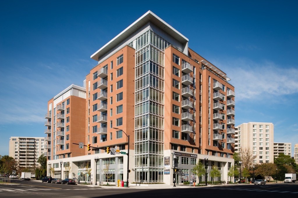How do you differentiate a new residential building? Kettler's m.flats in Crystal City does it with sustainable materials used creatively, such as locally sourced brick, metal paneling, metal balcony rails, glass-bay projecting towers, and a two-story limestone base.