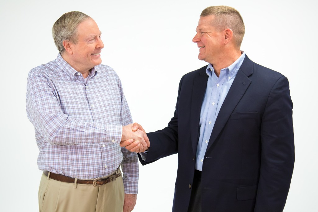 RealPage CEO Steve Winn, left, and On-Site president Monte Jones are happy about the deal their two companies reached.
