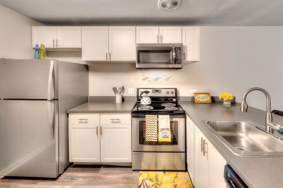 As part of its renovation of The Clayson, a 448-unit rental community in Palatine, Ill., Draper and Kramer added modern kitchens with white, Shaker-style cabinets; granite countertops; and stainless steel appliances.