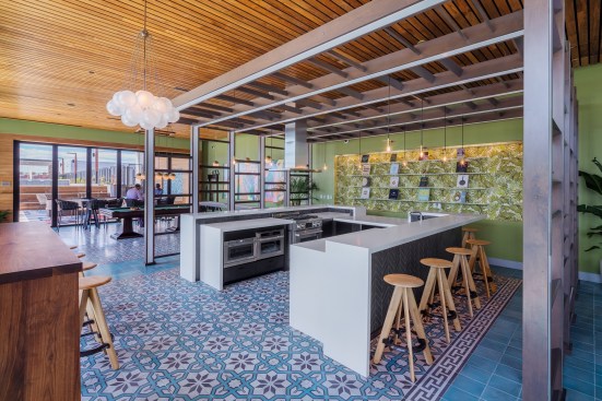 The shared kitchen space at The Apollo in Washington, D.C., lets residents host dinner parties or casual get-togethers on the building's rooftop.