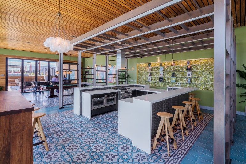 The shared kitchen space at The Apollo in Washington, D.C., lets residents host dinner parties or casual get-togethers on the building's rooftop.