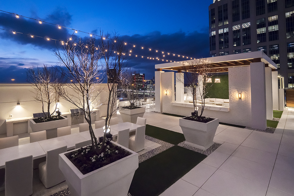 The 39th floor at Icon Midtown includes an outdoor entertainment terrace with fireplace, tables, and views of the Atlanta region.