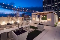 The 39th floor at Icon Midtown includes an outdoor entertainment terrace with fireplace, tables, and views of the Atlanta region.