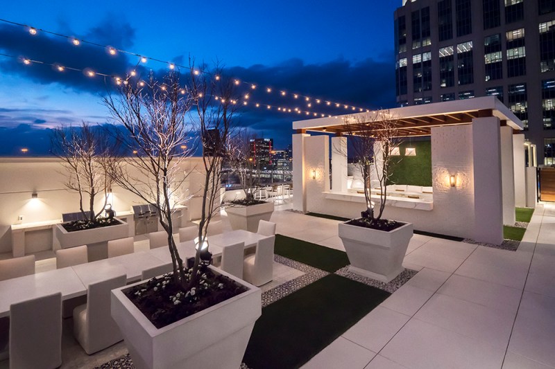The 39th floor at Icon Midtown includes an outdoor entertainment terrace with fireplace, tables, and views of the Atlanta region.