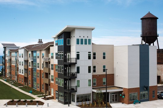 Rooflines zigzag up and down and colorful façades contribute a lively rhythm on the former industrial site at The Edison at Gordon Square. The water tower at right was retained, cleaned up, and remodeled and is available for lease.