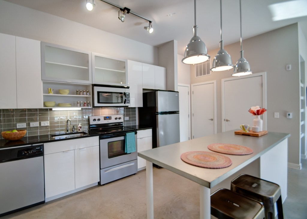 The White Buffalo apartments, Fort Worth, Texas, whose units are designed with efficient and modular kitchen and bath layouts.