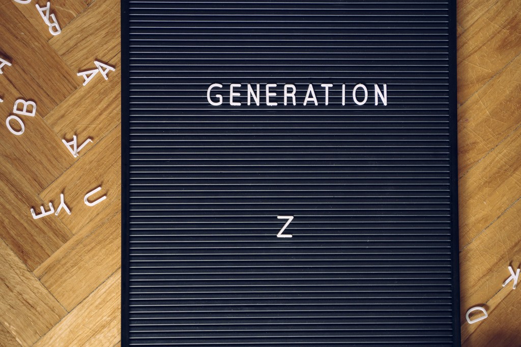 Isolated blackboard on the floor with a millennial message. Generation z ready to change the course of the world. Better and bright tomorrow. Ecology, concern about environment and technology concept.
