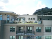 The Ashley Gables in Buckhead, Atlanta, Ga. A solar array and Tesla Battery storage system on the roof-top terrace provides shade and shelter for the dog park and generates energy to power the roof top lounge and other amenities. Courtesy Gables Residential.