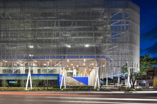 The screened-in public promenade on the ground level at the Citica development in Monterrey, Mexico.