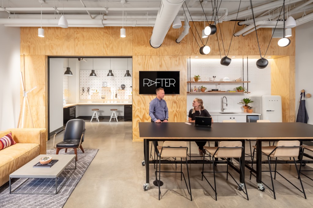 Rafter, a luxury multifamily community in Northeast Minneapolis, features an entire floor of several interconnected amenity zones, including a clubroom and a makers room.