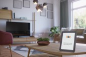 Smart Home Control With Tablet in scandinavian style living room interior. ( 3d render )