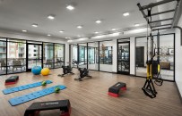 Popular fitness amenities in Mark-Taylor properties include spin bikes, yoga areas, and TRX suspension training.