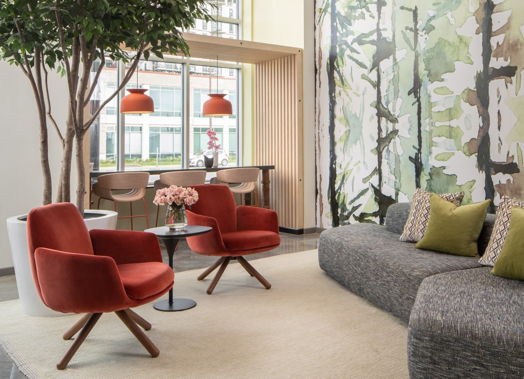 Solhem and TEMiller Development’s Ox-Op development in downtown Minneapolis welcomes residents and guests with a wallpapered street-level lounge designed by Martha Dayton Design.