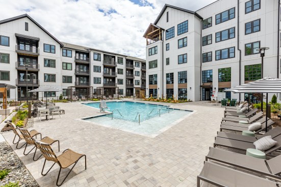 Amenities at NOVEL Cary in Cary, North Carolina, feature a saltwater pool with cabanas as well as a hammock lawn.