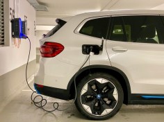 A car charging at a charging station