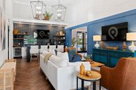 The amenity package at Hillpointe's Pointe Grand Byron in Georgia boasts a resort-style pool and cabanas with refrigerators; grills and a fire pit; a leash-free bark park and pet spa; a business center; and a clubhouse with a tea and coffee bar for residents to enjoy.