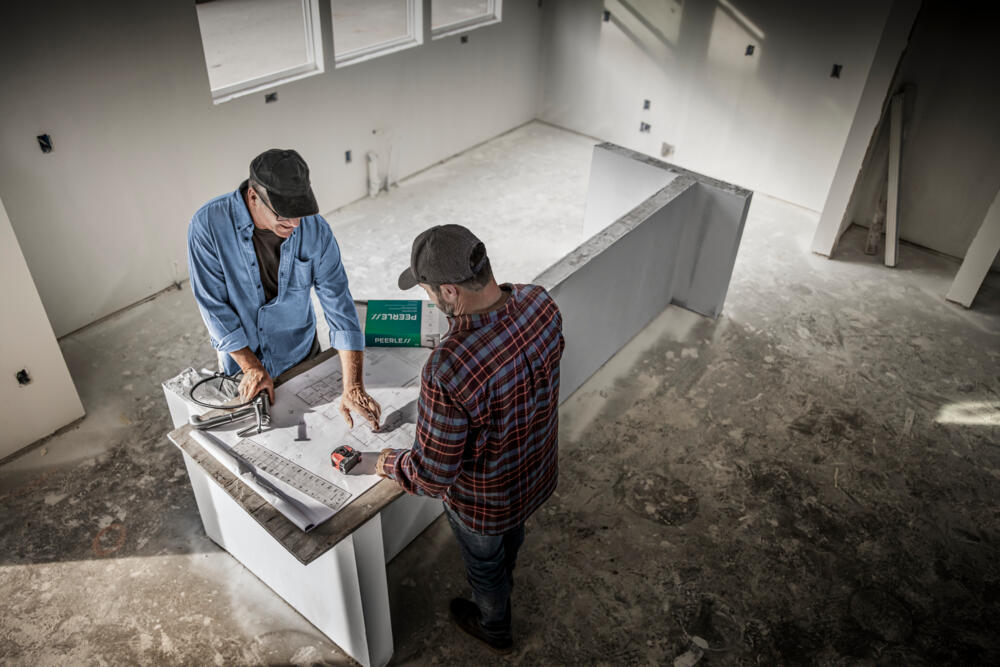 a man installing a faucet