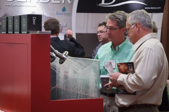 As multifamily development continues to grow, more manufacturers were on-site with their products and services for new projects. Here, attendees examine the forceful, yet water-saving features of these showerheads.