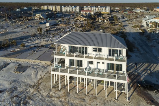 A large white house with a gray roof