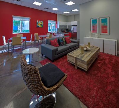 The development also includes a clubhouse, business center, a library, fitness center, and a communal kitchen and area for residents to gather.