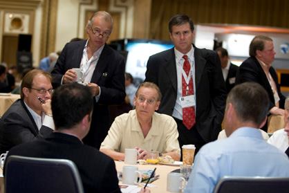Steve Falcone (seated, far left), executive vice president of Senior Village Management, leads a breakfast roundtable discussion on the challenges of serving senior residents. Additional roundtables that morning focused on other demographic groups, including immigrants and Gen Y.