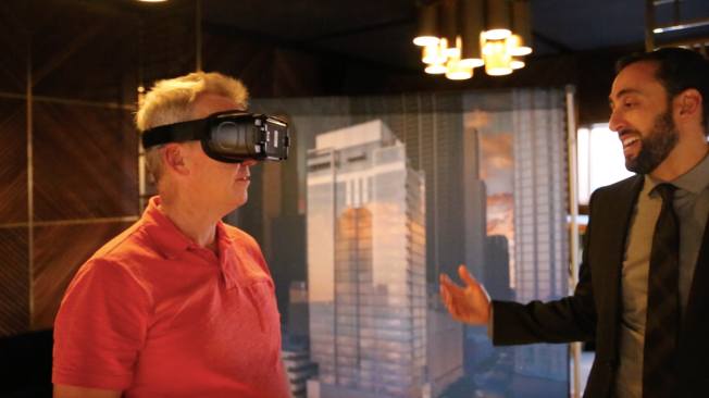 A prospect uses virtual reality to experience 8 East Huron, a Luxury Living Chicago property.